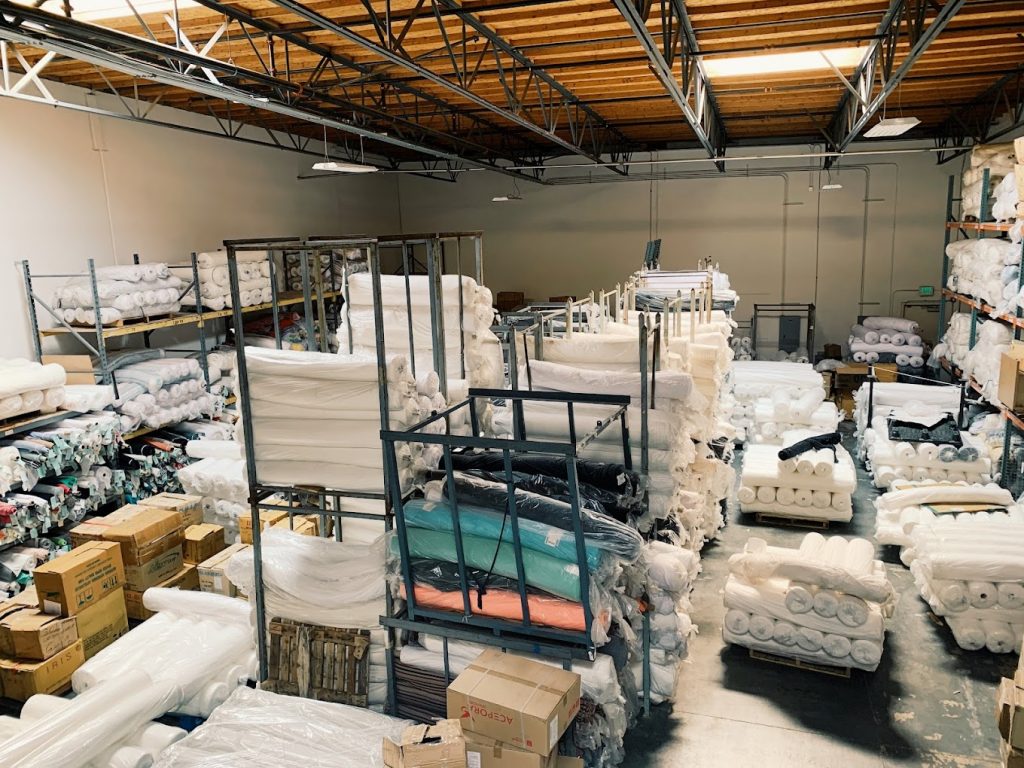 knitting mill overview showing rolls of fabric