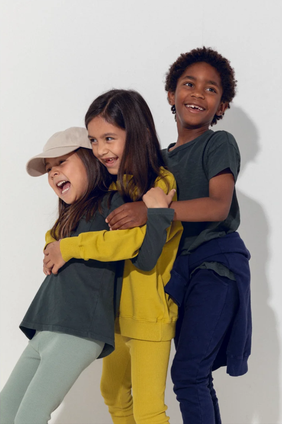 kids leisure clothing worn by three child models